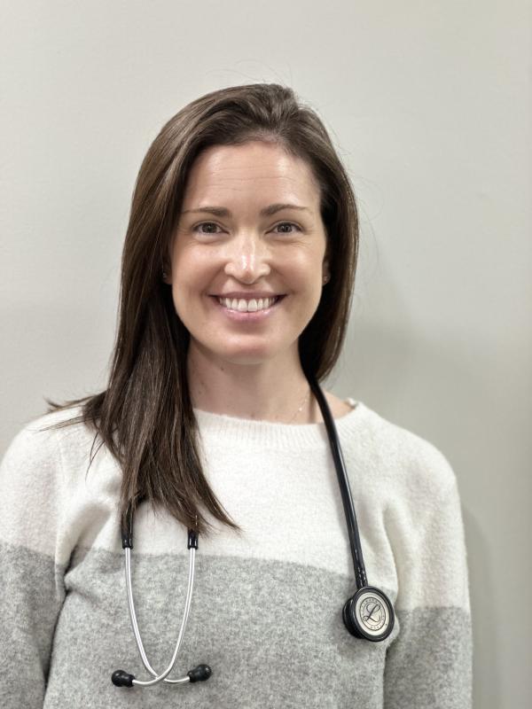 a headshot of a medical professional woman