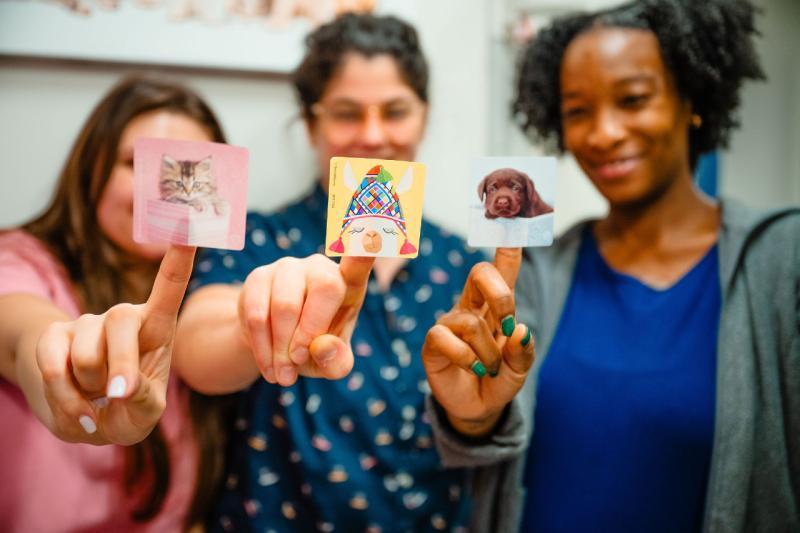 medical professional women holding up stickers on their fingers