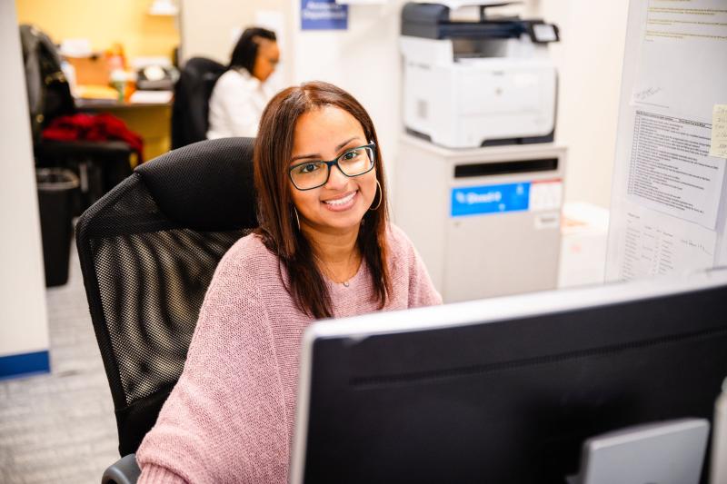 a pretty smiling woman receptionist